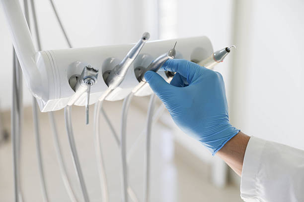 Professional Tooth Extraction technician working in Harbor Isle, NY